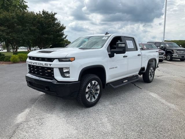 2022 Chevrolet Silverado 2500 HD Custom in Summit White — front three-quarter view
