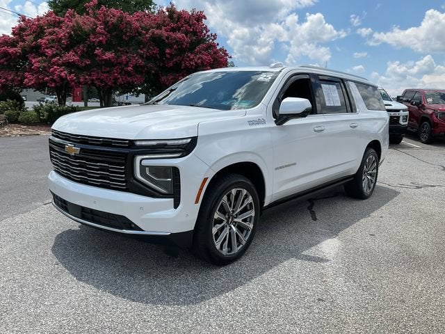 2025 Chevrolet Suburban High Country in Iridescent Pearl Tricoat — front three-quarter view