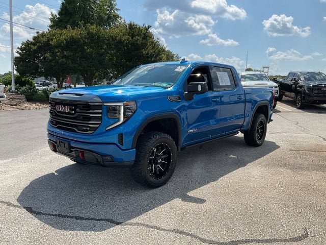 2022 GMC Sierra 1500 AT4 in Dynamic Blue Metallic — front three-quarter view